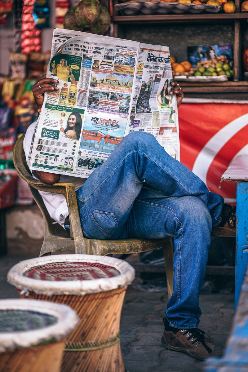 obscure, alone, business, low section, mature, paper, market, chairs, retail, communication, tabloid, newspaper, waiting, casual clothing, fruits, information