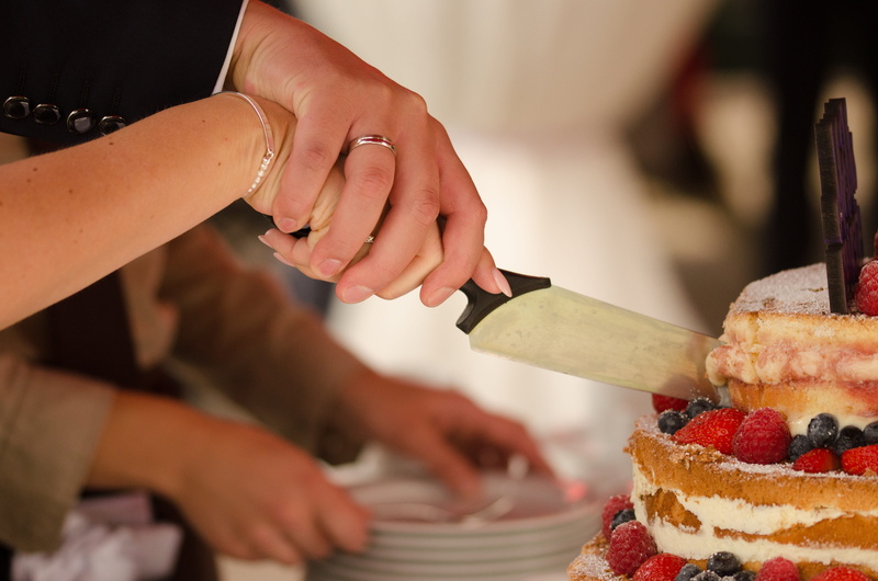 food and drink, togetherness, oath, connectedness, symbol, focus on foreground, dessert, berry fruit, marriage, chef, indoors, wedding cake, women, wedding day