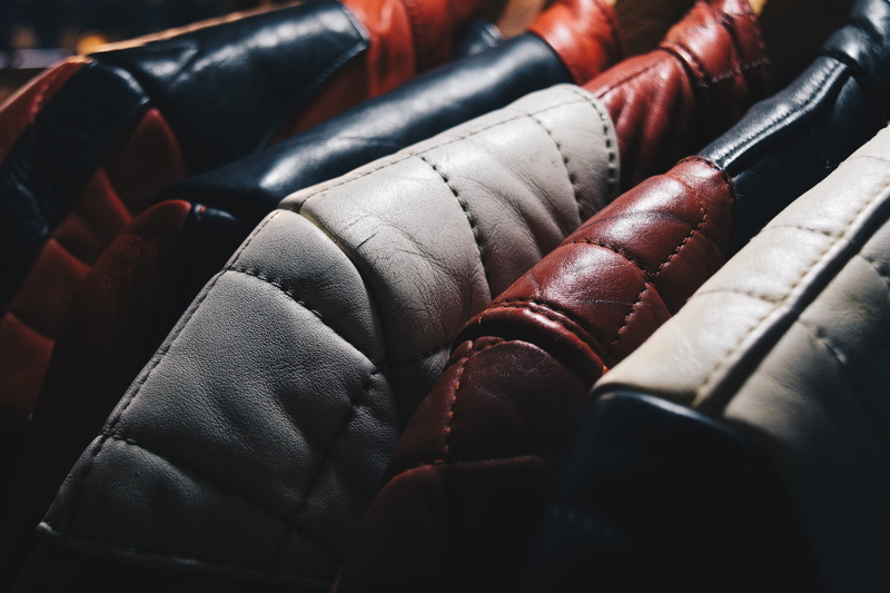 textile, black color, leather jackets, pad, punching, stack, leather, in a row, large group of objects, no People, selective focus, full frame, business
