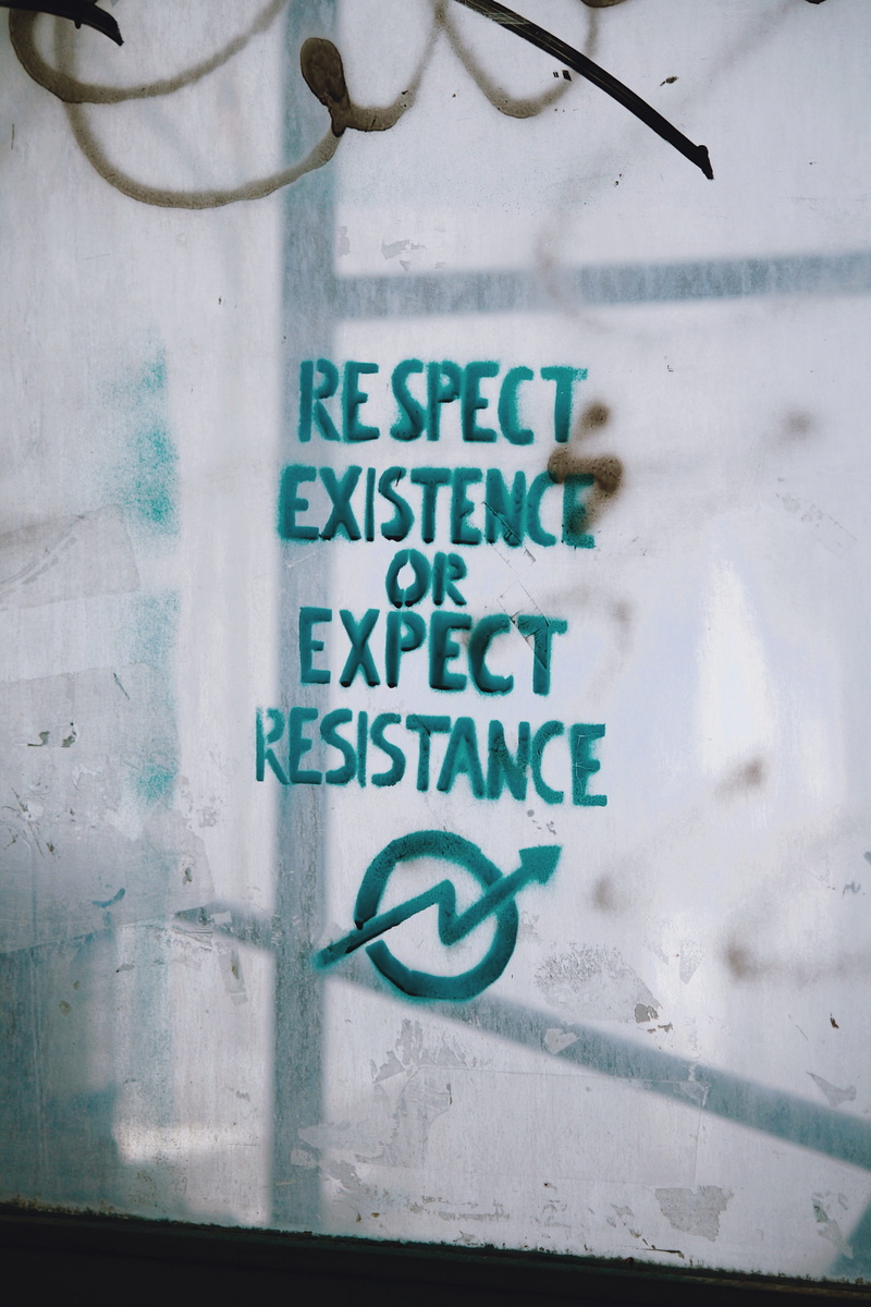 low angle view, capital letter, information, communication, day, wall - building feature, board, no people, resistance, number, outdoors, writing, white color
