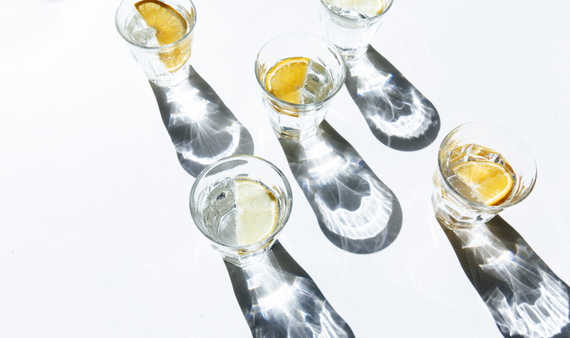 5K, drinking glass, studio shot, refreshment, glass - material, shot glass, still life, glass, alcohol, shot, sunlight, no people, five, orange, slice