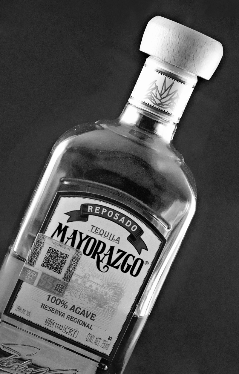 indoors, vintage, Bottle, symbol, design, high angle view, still life, communication, cork - stopper, cool, label, transparent, Tequila, beverage, lime