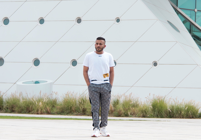 portrait, lifestyles, people, full length, juggling, human, low angle view, mid adult men, fashion, shoe, day, looking at camera, holding, young adult