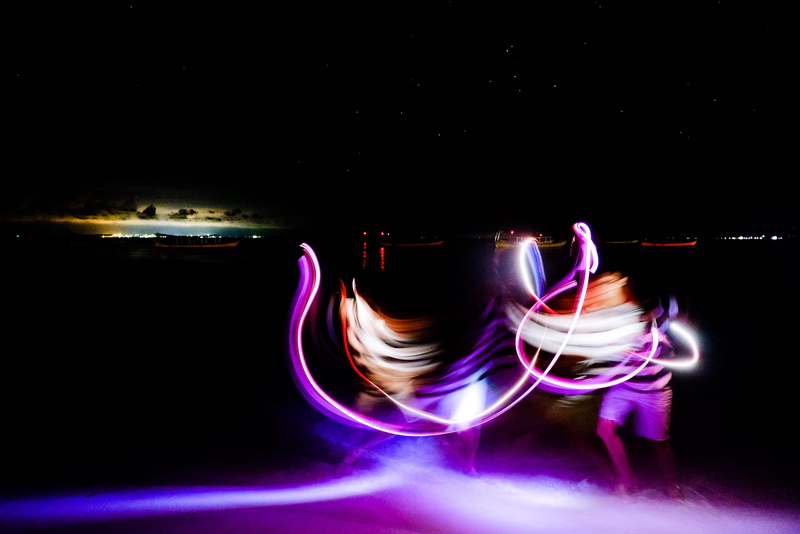 performance, juggling, studio shot, copy space, duel, multi colored, one person, wheel, light painting, lighting, alloy wheel, stage, light - natural phenomenon