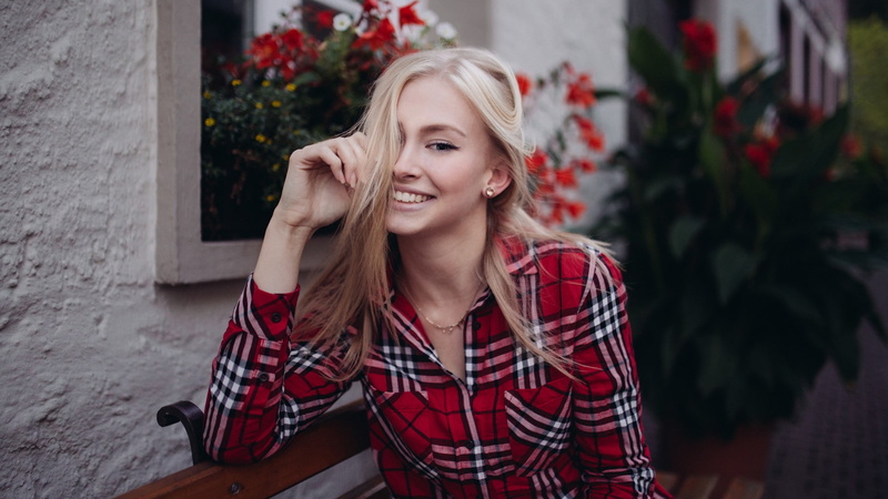 women, blonde, checkered, bench, sitting, long hair, plaid shirt, hair in face, model, 1080P, flowers, house, looking at viewer, shirt, smiling, women