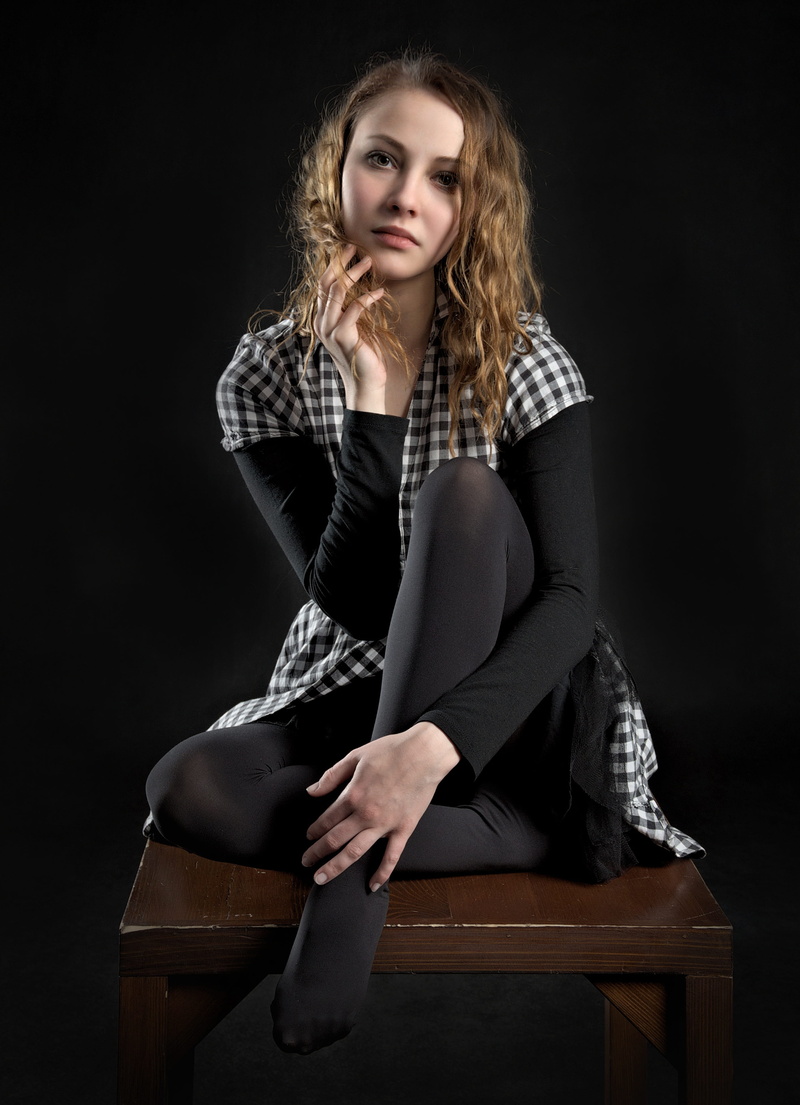 young women, hair, front view, button, full length, woman, hairstyle, one person, look, sitting, white, adult, beautiful woman, black background, fashion model