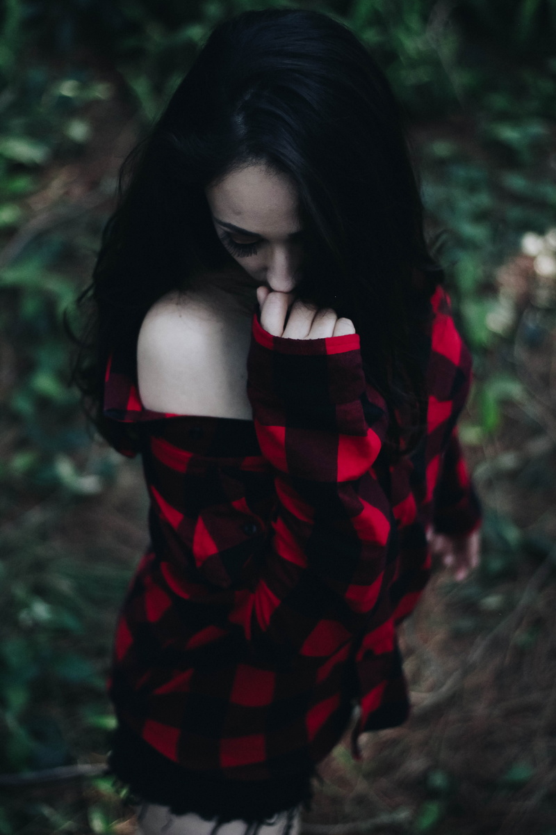 young adult, sleeved, beautiful woman, plaid, woman, teenager, lifestyles, looking down, dark, contemplation, casual clothing, hairstyle, garden, nature