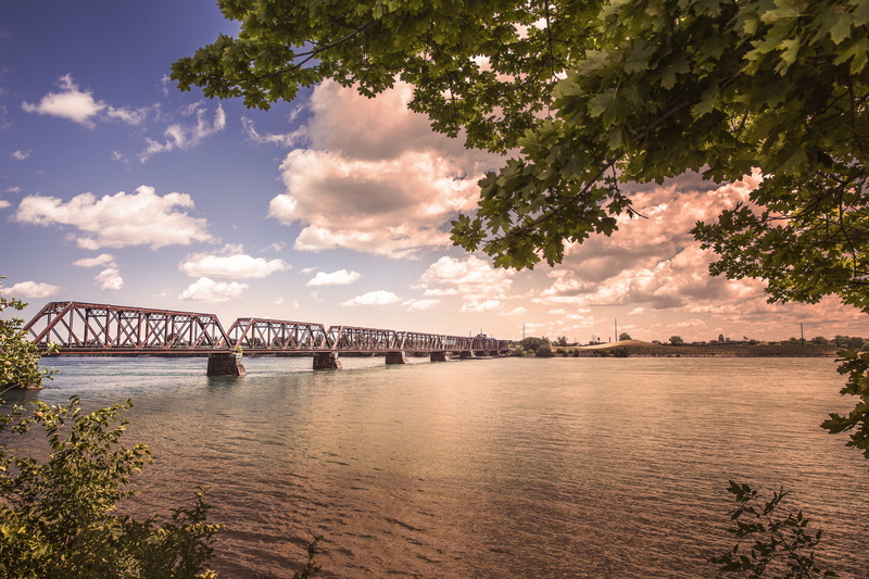 cloud - sky, clouds, bridge - Man Made Structure, tree, blue, blue sky, architecture, famous Place, outdoor, engineering, objects, river, niagra, beauty in nature
