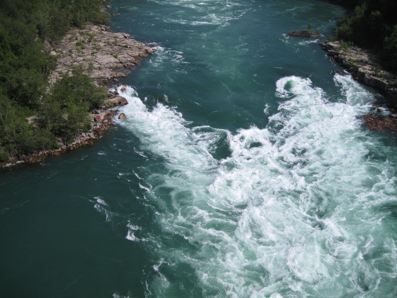 water, tourism, power in nature, waterfront, land, rapids, high angle view, scenics - nature, blurred motion, travel, flowing water, Niagra Falls, blue