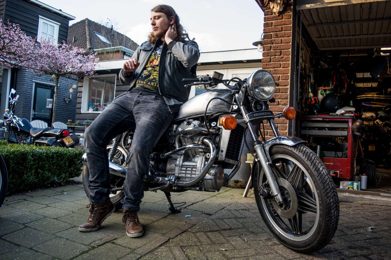 chrome, motor, hairstyle, adult, cx500, young adult, cafe racer, building exterior, motorcycle, mode of transportation, architecture, built structure, jacket