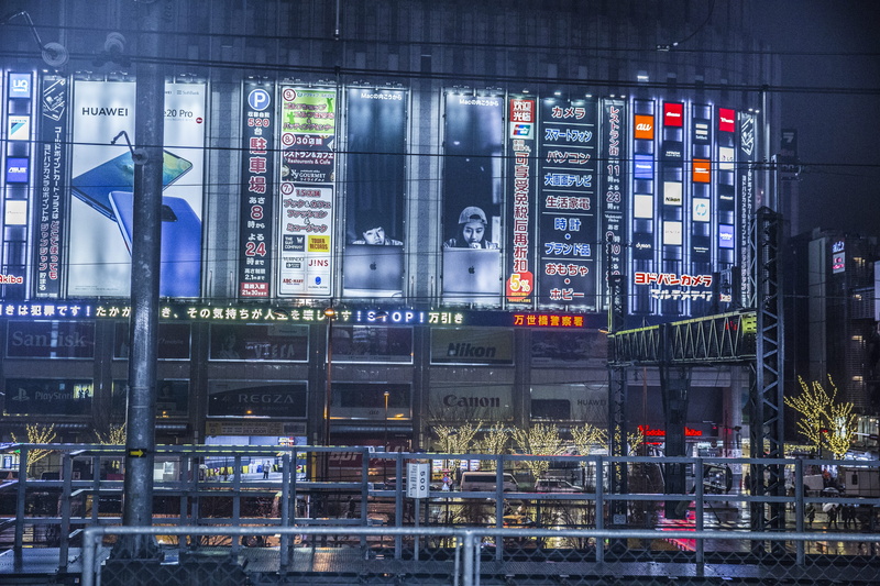 billboards, transportation, airplane, city, lights, sign, architecture, billboard, handrail, aircraft, outdoors, high rise, no people, city life, shop