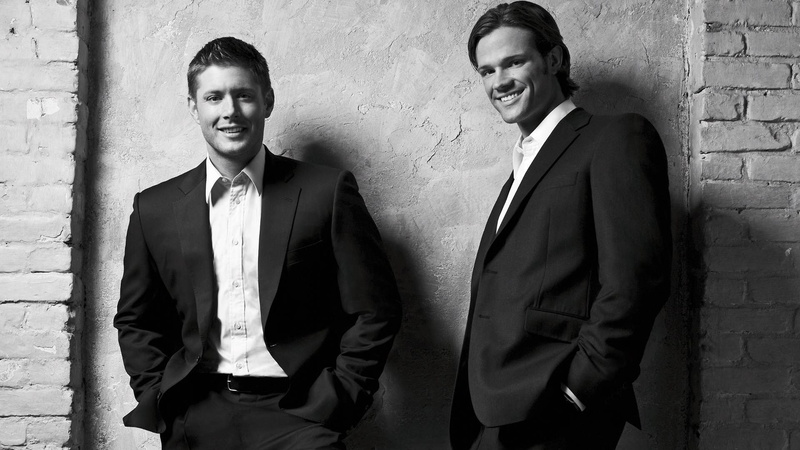 people, front view, men, menswear, well-dressed, looking at camera, young adult, waist up, standing, real people, brick, supernatural computer  backgrounds