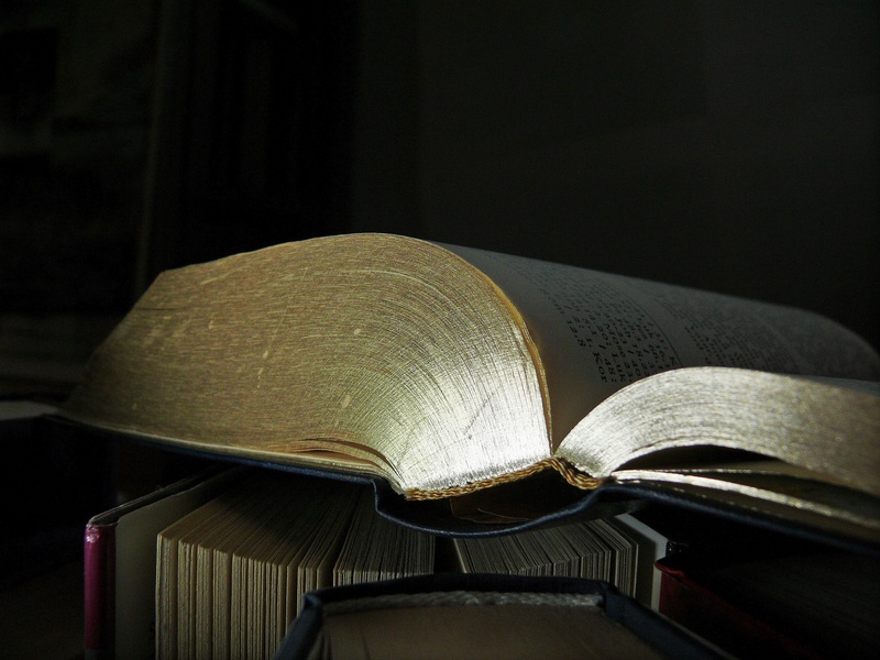 2K, religion, focus on foreground, white, belief, read, publication, open, literature, black background, newspaper, school, books, single object, close-up