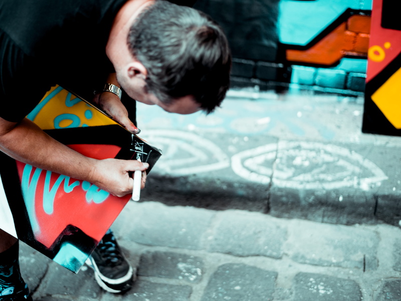 lifestyles, 4K, graffiti, adults only, leisure activity, focus on foreground, bending, person, casual clothing, people, daytime, one man only, black, creativity