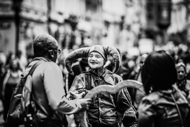 photo, women, 8K, focus on foreground, city life, day, casual clothing, young adult, outdoors, person, waist up, street, people, lifestyles, wearing, grayscale