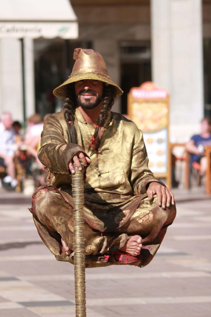 government, street, one person, 4K, clothing, sitting, men, military, architecture, front view, street artists, real people, looking at camera, day, illusionist