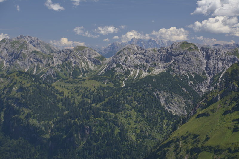 no people, mood, valley, landscape, mountain range, outdoors, mountain peak, environment, idyllic, panorama, sky, sun, nature, remote, tranquility, cloud - sky