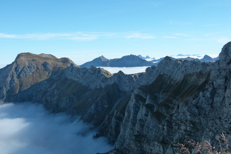 foghorn, sky, nature, outdoors, non-urban scene, travel destinations, fog, rock formation, no people, formation, climbing, landscape, environment, cloud - sky