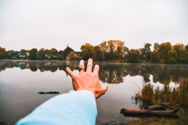  hands, trees, real people, sky, human finger, leisure activity, gesturing, human limb, pond, hipster, hues, lake, water, nature, lifestyles