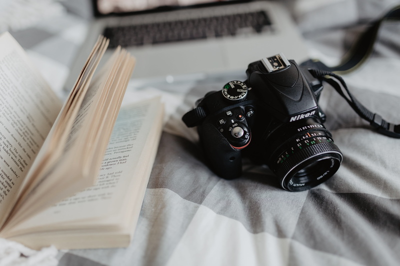 nikon, bed, table, technology, room, camera - photographic equipment, focus on foreground, photography themes, book, photographic equipment, antique, slr camera