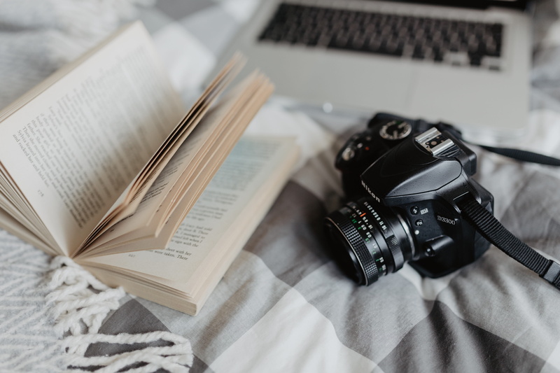 photographer, no people, education, close-up, camera - photographic equipment, book, high angle view, bedroom, bedding, table, computer, communication