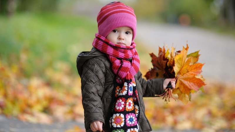 plant part, child, leisure activity, smiling, winter, warm clothing, portrait, outdoors, jacket, leaf, girls, clothing, beautiful, childhood, beauty In Nature