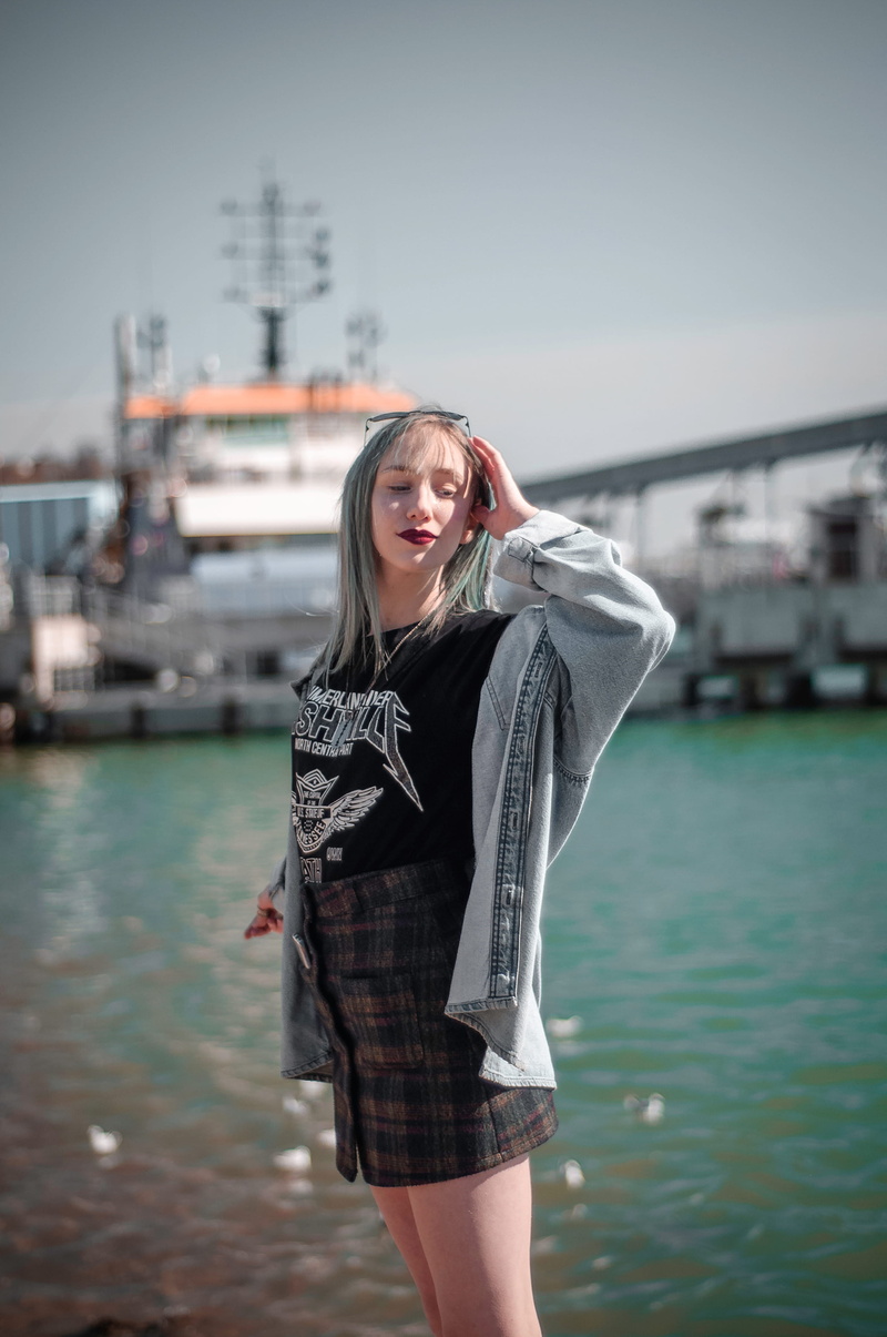 apparel, looking at camera, standing, three quarter length, front view, female, beautiful woman, nautical vessel, daytime, real people, blue, pier, water