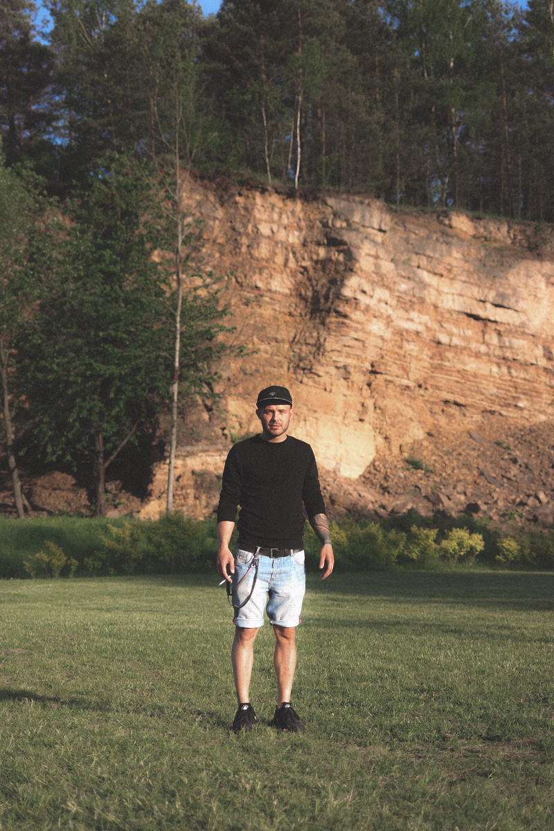 field, clothing, leisure activities, green, outdoors, human, person, land, real people, full length, front view, tree, forest, young adult, cap, nature