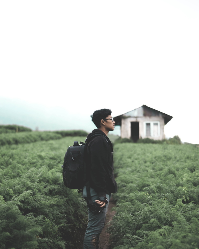 real people, leisure activity, malang, gravel, jacket, plant, day, clear sky, outdoors, nature, road, standing, young men, one person, field, dirt road