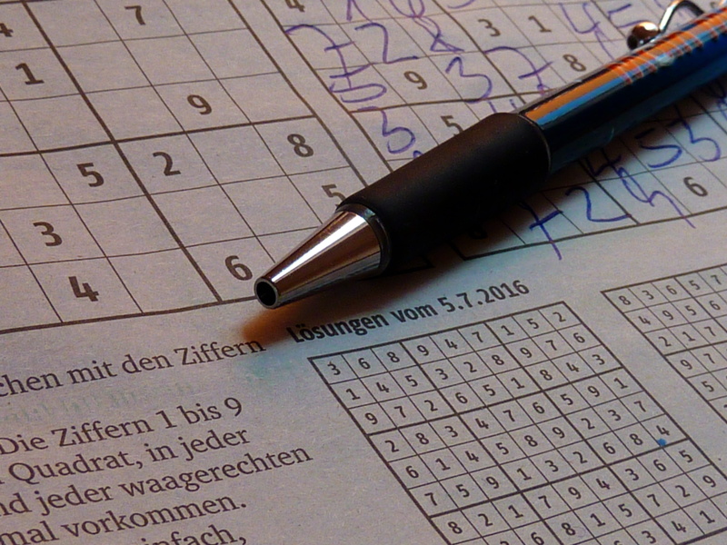 company, no people, still life, sudoku, high angle view, handwriting, 2K, book, text, close-up, publication, communication, page, indoors, letter, puzzles