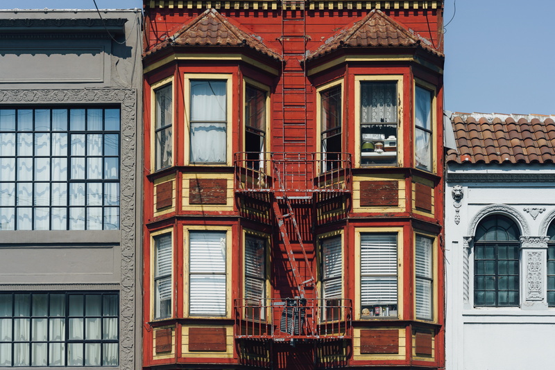 windowshade, glass, building, facade, beaten down, building exterior, street, sunlight, roof tile, apartment, outdoors, ladder, old, red, history, window