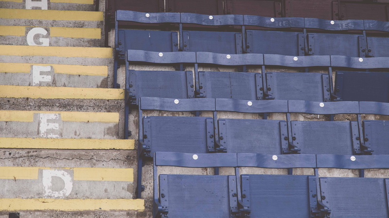 wood - material, wall - building feature, chairs, in a row, blue, pattern, seat, benches, outdoors, black, container, seating, stadium, 5K, close-up, empty