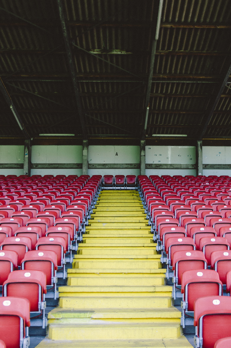 empty, repetition, bleachers, arts culture and entertainment, order, arrangement, pattern, red, indoors, gray, side by side, ceiling, diminishing perspective