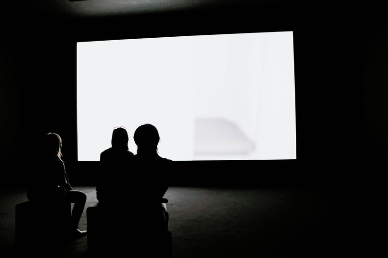 females, women, shadow, indoors, people, screen, looking, togetherness, copy space, lifestyles, leisure activity, wall - building feature, projection, silhouette