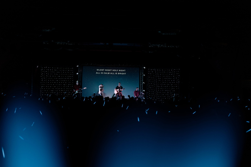 dark, arts culture and entertainment, person, watching, crowd, projection screen, rock, group of people, stage - performance space, spectator, entertainment event