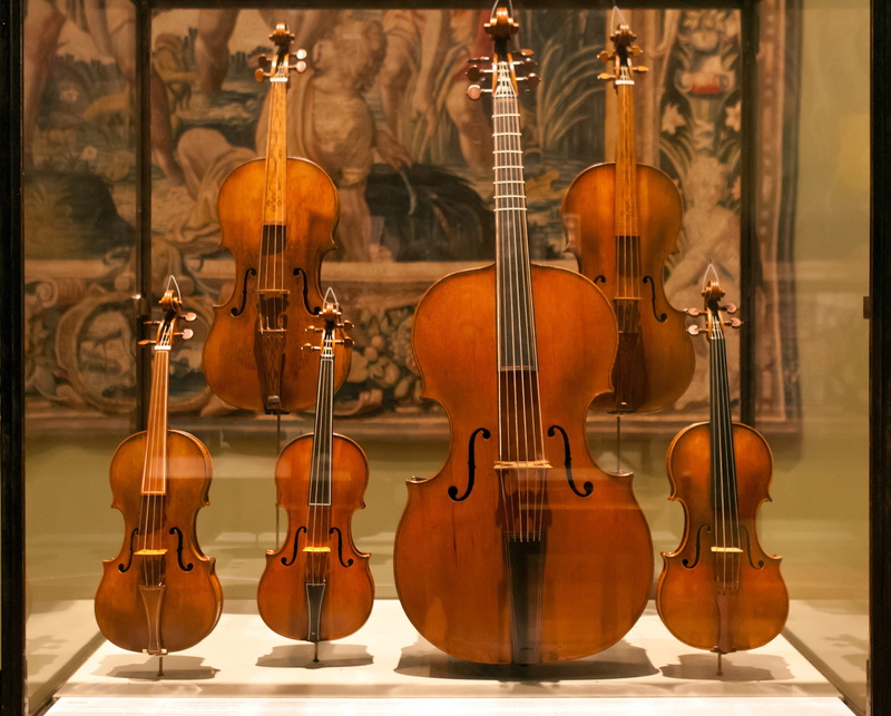 violin, musical instrument, focus on foreground, musical equipment, classical music, 2K, wood - material, viol, music, still life, display case, arts culture and entertainment