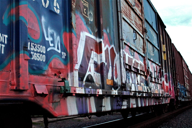graffitiart, track, communication, built structure, art, no people, railroad track, rail transportation, mode of transportation, old, outdoors, text, container