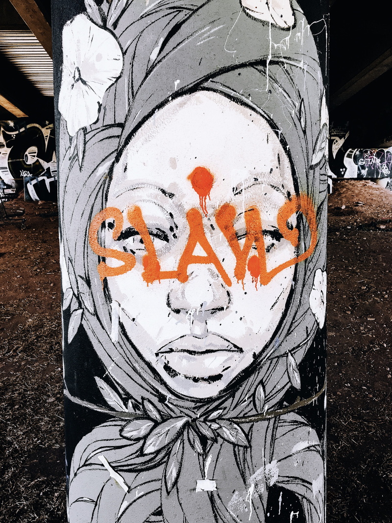 anthropomorphic face, graffiti, close-up, street, white color, communication, orange color, streetart, high angle view, no people, atlanta, art and craft