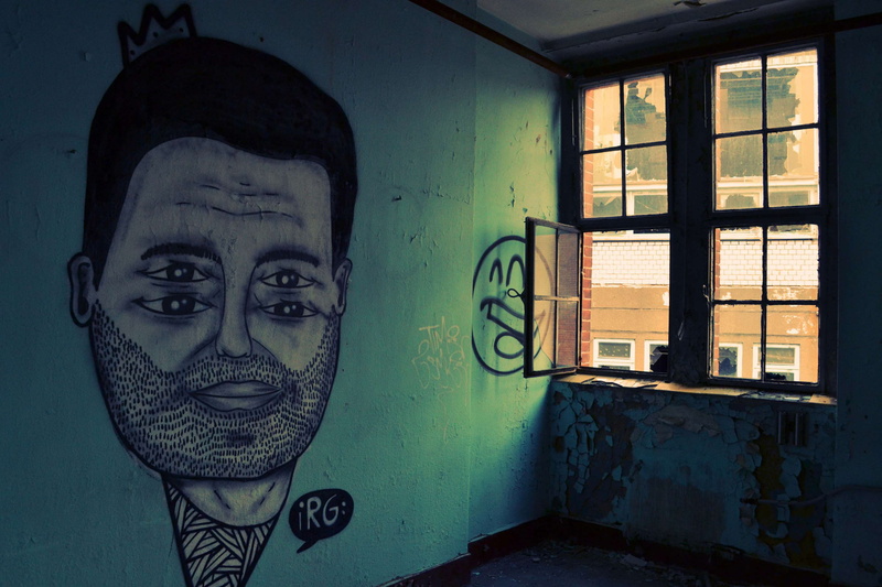 street art, graffiti, architecture, looking at camera, street, spraypaint, day, painting, front view, abstract, rugged, one person, spooky, urban, creativity