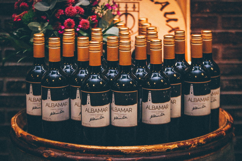 side by side, red wine, refreshment, indoors, red, in a row, party, food and drink, western script, bottles, alcohol, no people, still life, wine, wine Bottle