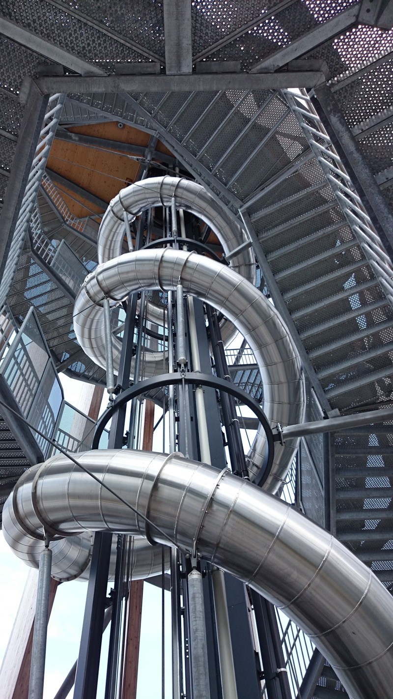 built structure, land vehicle, alloy, pipe - tube, no people, steel, mode of transportation, modern, spiral, day, travel, low angle view, slide, architecture