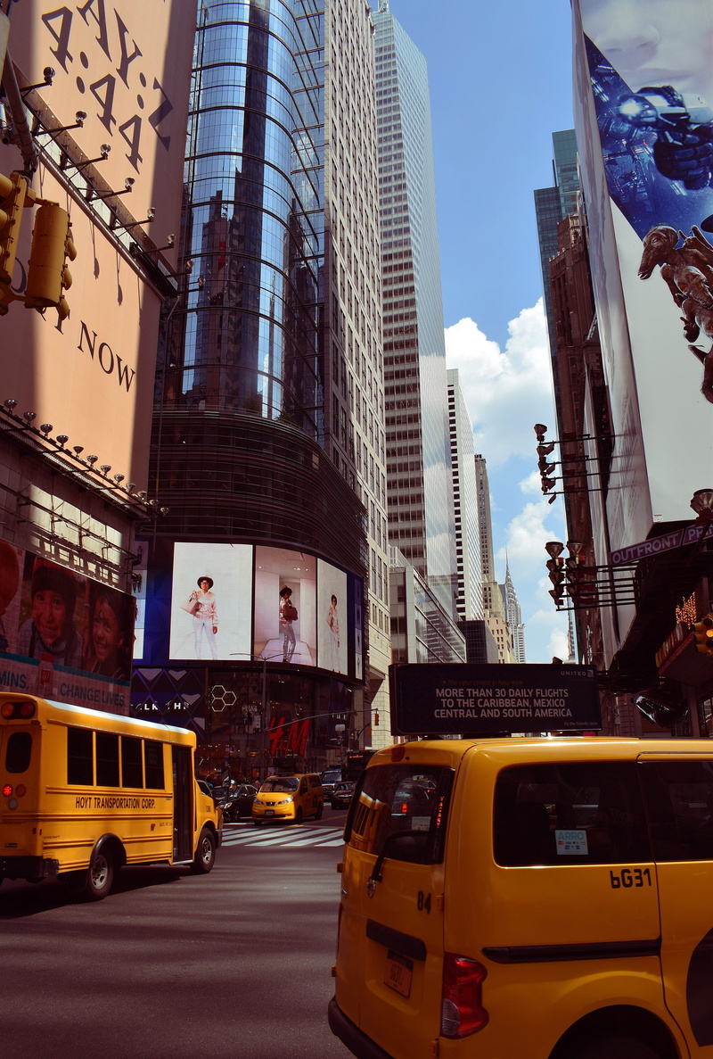 road, taxi, building exterior, sky, urban, skyscraper, modern, high, outdoors, street, right, motor vehicle, city, photography, middle, tall - high, yellow