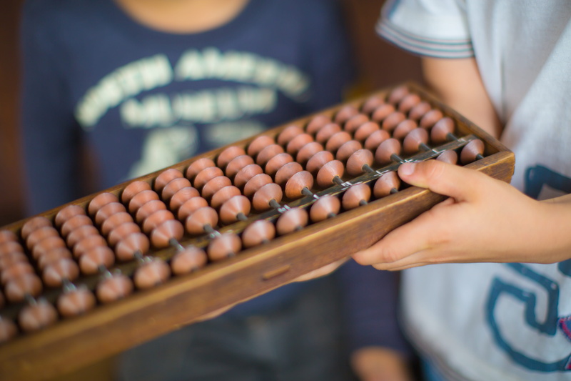 kids, numbers, adult, women, midsection, child, females, 5K, finance, human body part, childhood, holding, learning, hand, close-up, abacus, indoors, focus on foreground