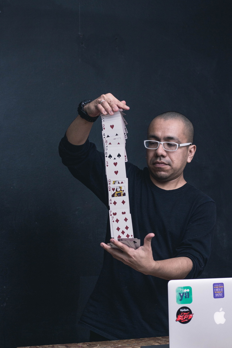 computer, holding, person, waist up, card trick, apparel, arm, portrait, accessories, indoors, first aid, tie, casual clothing, one person, 5K, young men