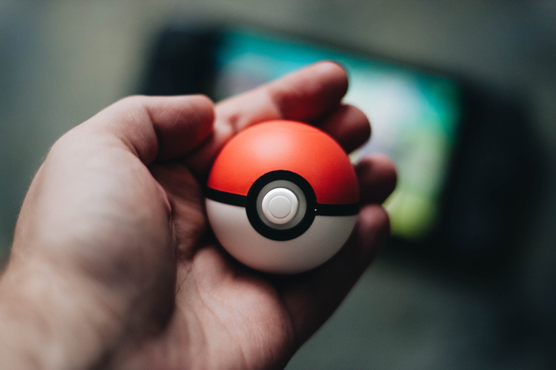 car, medical equipment, indoors, occupation, pokemon, holding, finger, adult, human finger, toy, equipment, hand, close-up, human hand, sport, pokeball