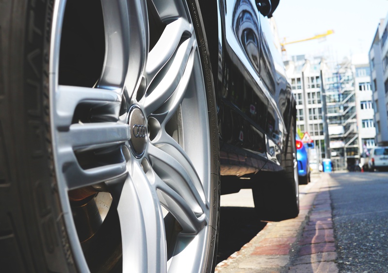 road, sunlight, transportation, new, audi, building exterior, wheels, park, sporty, street photography, motor vehicle, city, vehicle, automotive, city ​​consumption