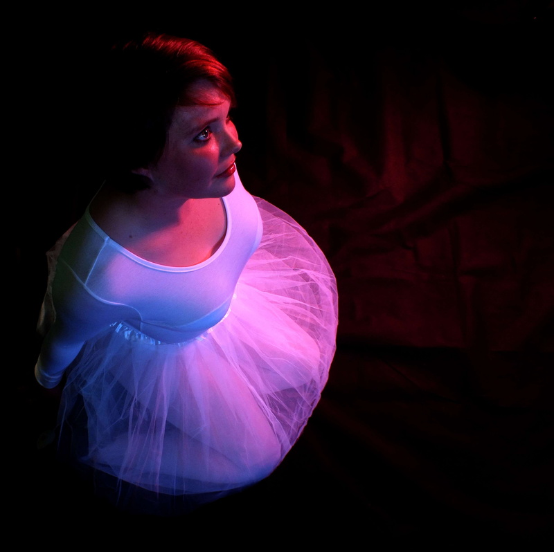 full length, chubby ballerina, contemplation, real people, leisure activity, dancing, looking, sitting, stage, 2K, young adult, casual clothing, women
