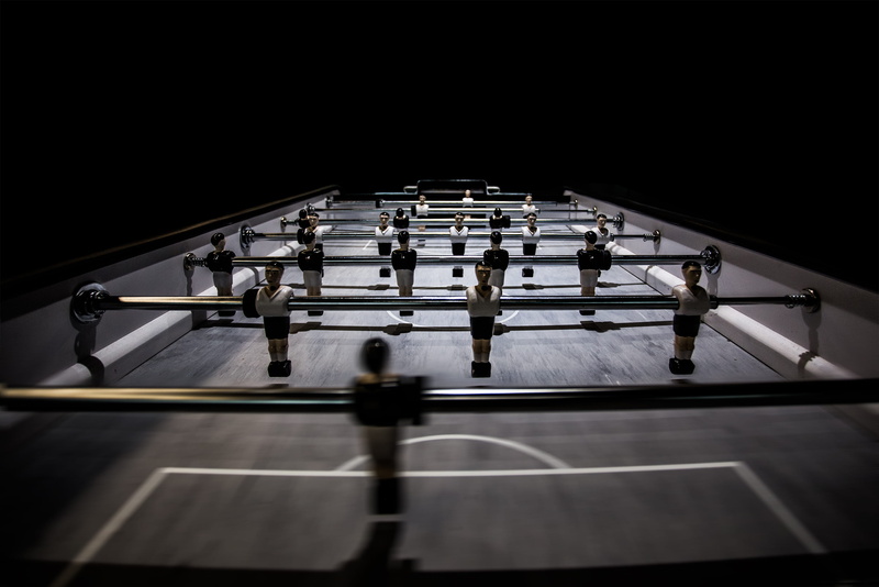 football game, game, built structure, indoor, motion, low angle view, blurred motion, table, teen, metal, architecture, table football, arts culture and entertainment