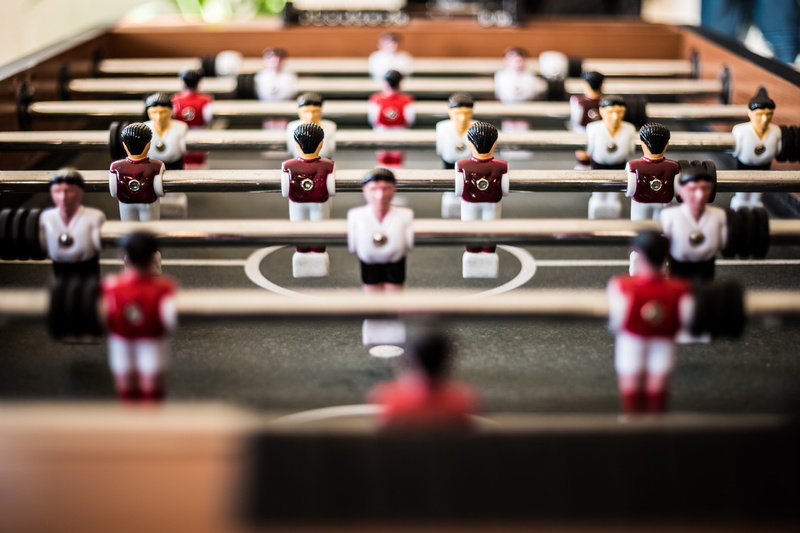 game, relaxation, close-up, male likeness, human representation, leisure games, table, in a row, figurine, selective focus, voetbal, tablesoccer, pub game