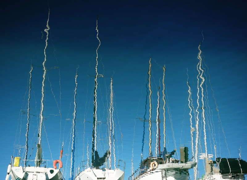 transportation, ripple, low angle view, marina, rigging, reflection, built structure, sailing, sunlight, no people, sailboat, nautical vessel, distortion